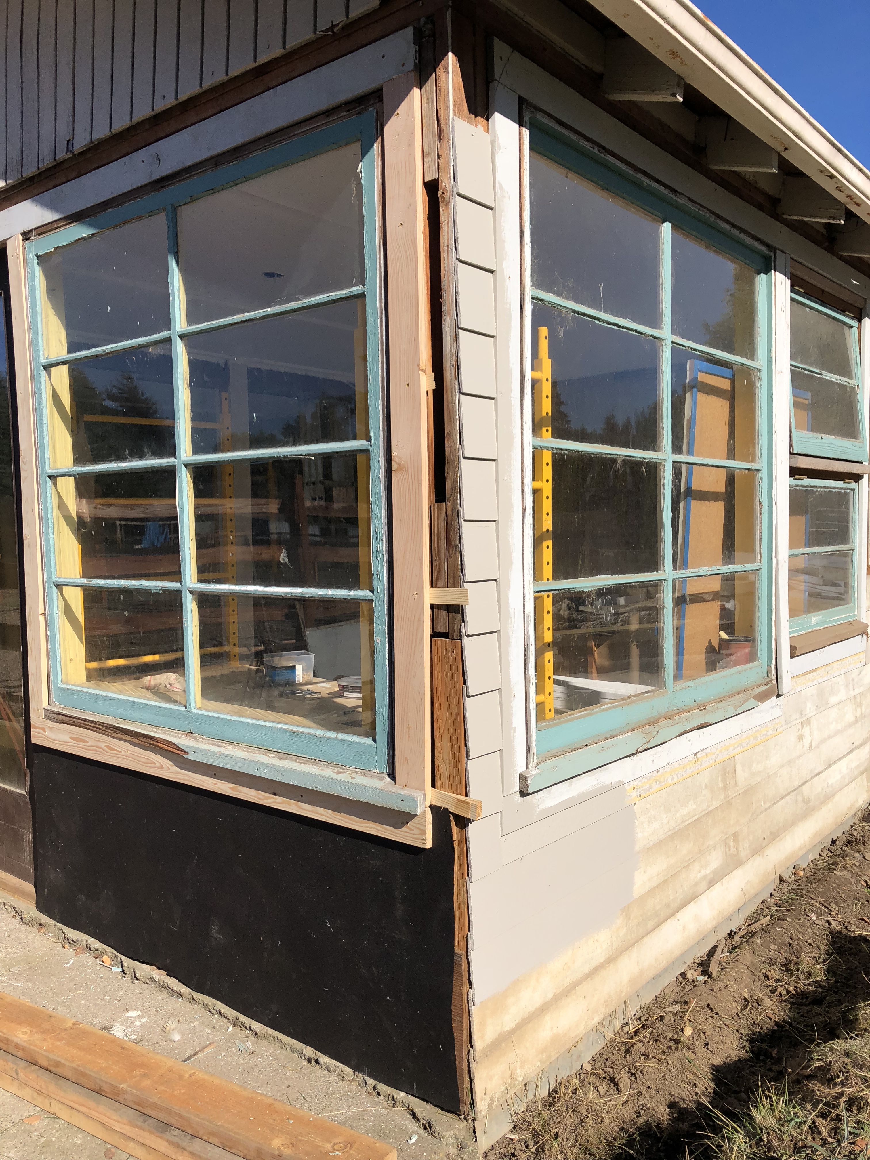 Working on the exterior of the cottage art studio.